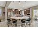 Modern kitchen with large island, stainless steel appliances, and breakfast bar at 251 Castellari Dr, Las Vegas, NV 89138