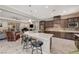 Open concept kitchen with large island and breakfast bar, overlooking living room at 251 Castellari Dr, Las Vegas, NV 89138