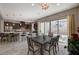 Modern kitchen with dark cabinets, island, and breakfast bar at 251 Castellari Dr, Las Vegas, NV 89138