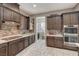 Modern kitchen with stainless steel appliances and custom cabinetry at 251 Castellari Dr, Las Vegas, NV 89138