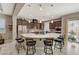 Modern kitchen with large island, stainless steel appliances, and breakfast bar at 251 Castellari Dr, Las Vegas, NV 89138