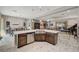 Open concept kitchen with large island and sink, overlooking living room at 251 Castellari Dr, Las Vegas, NV 89138