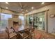 Outdoor patio with fireplace, dining area and view into the home at 251 Castellari Dr, Las Vegas, NV 89138