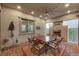 Covered patio with fireplace, dining table and seating area at 251 Castellari Dr, Las Vegas, NV 89138