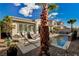 Inviting pool with hanging chairs and palm trees at 251 Castellari Dr, Las Vegas, NV 89138