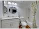 Updated bathroom with white vanity, tub, and shower at 3024 Saint George St # H, North Las Vegas, NV 89030