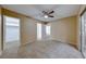 Spacious bedroom with mirrored closet and ceiling fan at 3024 Saint George St # H, North Las Vegas, NV 89030