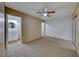 Bright bedroom with ceiling fan and access to bathroom and closet at 3024 Saint George St # H, North Las Vegas, NV 89030