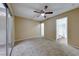 Bedroom with access to bathroom and sliding glass door at 3024 Saint George St # H, North Las Vegas, NV 89030