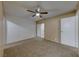 Bedroom with white brick accent wall and ceiling fan at 3024 Saint George St # H, North Las Vegas, NV 89030