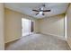 Bedroom with patio access and ceiling fan at 3024 Saint George St # H, North Las Vegas, NV 89030