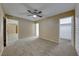 Bright bedroom with ceiling fan and access to another room at 3024 Saint George St # H, North Las Vegas, NV 89030