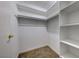 Large walk-in closet with shelving and hanging rods at 3024 Saint George St # H, North Las Vegas, NV 89030