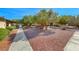 Community courtyard with mature trees and gravel landscaping at 3024 Saint George St # H, North Las Vegas, NV 89030