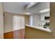 Eat-in kitchen with a breakfast bar and white cabinets at 3024 Saint George St # H, North Las Vegas, NV 89030