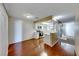 Eat-in kitchen with white cabinetry and hardwood floors at 3024 Saint George St # H, North Las Vegas, NV 89030