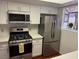 Modern kitchen with stainless steel appliances and white cabinets at 3024 Saint George St # H, North Las Vegas, NV 89030