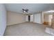 Living room with access to other rooms and carpet flooring at 3024 Saint George St # H, North Las Vegas, NV 89030