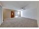 Bright living room featuring carpet and ceiling fan at 3024 Saint George St # H, North Las Vegas, NV 89030