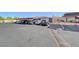Parking lot with covered spaces and building view at 3024 Saint George St # H, North Las Vegas, NV 89030