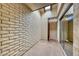 Small patio area with brick walls and skylight at 3024 Saint George St # H, North Las Vegas, NV 89030