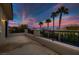 Private balcony with sunset view and palm trees at 3042 Hammerwood Dr, Las Vegas, NV 89135