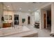 Luxurious bathroom with double vanities, soaking tub, and walk-in closet at 3042 Hammerwood Dr, Las Vegas, NV 89135