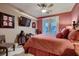 Serene bedroom with a comfortable bed and access to a private balcony at 3042 Hammerwood Dr, Las Vegas, NV 89135
