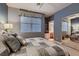 Guest bedroom with mirrored closet and ensuite bathroom at 3042 Hammerwood Dr, Las Vegas, NV 89135