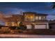 Stunning two-story home with stone accents, a balcony, and well-maintained landscaping at 3042 Hammerwood Dr, Las Vegas, NV 89135