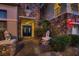 Inviting front entrance with double doors, stone pillars, and manicured landscaping at 3042 Hammerwood Dr, Las Vegas, NV 89135