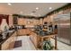 Large kitchen with an island, ample storage, and stainless steel appliances at 3042 Hammerwood Dr, Las Vegas, NV 89135