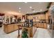 Gourmet kitchen boasts a large island, ample cabinetry, and granite countertops at 3042 Hammerwood Dr, Las Vegas, NV 89135