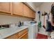 Laundry room with washer, dryer, and cabinets at 3042 Hammerwood Dr, Las Vegas, NV 89135