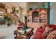 Spacious living room with large wooden cabinet and comfortable seating at 3042 Hammerwood Dr, Las Vegas, NV 89135