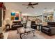Open living room with a view into the kitchen and access to the backyard at 3042 Hammerwood Dr, Las Vegas, NV 89135