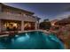 Expansive backyard oasis with a large pool and covered patio at 3042 Hammerwood Dr, Las Vegas, NV 89135