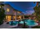 Stunning pool area with rock formations and a large pool at 3042 Hammerwood Dr, Las Vegas, NV 89135