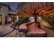 Enjoy this outdoor tiki bar with seating for entertaining at 3042 Hammerwood Dr, Las Vegas, NV 89135