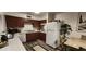 Well-equipped kitchen featuring modern appliances and wood-look flooring at 350 E Desert Inn Rd # 202, Las Vegas, NV 89109