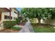 Landscaped walkway between apartment buildings with lush greenery at 350 E Desert Inn Rd # 202, Las Vegas, NV 89109