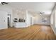 Open concept living room and kitchen with light wood flooring, high ceilings and recessed lighting at 3704 Russian Olive St, North Las Vegas, NV 89032