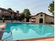 Inviting community pool with surrounding patio at 3996 Tirana Way, Las Vegas, NV 89103