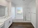 Modern bathroom with soaking tub, walk-in shower, and double vanity at 4372 Latitude Valley Ct, North Las Vegas, NV 89084