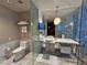 Modern bathroom featuring a toilet, sink, and glass-enclosed shower at 4381 W Flamingo Rd # 2116, Las Vegas, NV 89103