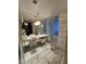 Elegant bathroom with marble floors and a large walk-in shower at 4381 W Flamingo Rd # 2116, Las Vegas, NV 89103