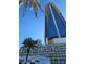 Luxury high-rise building with modern architecture and palm trees at 4381 W Flamingo Rd # 2116, Las Vegas, NV 89103