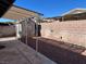 Covered patio, gravel yard, and storage shed at 4438 Galore Ave, Las Vegas, NV 89115