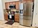 Modern kitchen with stainless steel appliances and wood cabinets at 4700 E Brolio Ct, Pahrump, NV 89061