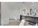 Elegant bathroom with double vanity and tile floor at 525 Front Range Ln, North Las Vegas, NV 89084